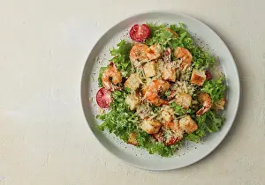 Shrimp Caesar Salad Recipe Drucke: Caesar salad, with shrimp, on a white background