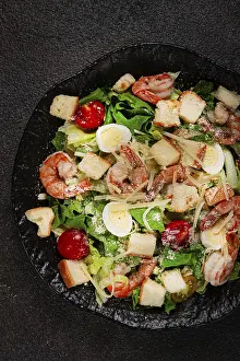 Crustacean Dish Drucke: Caesar salad with tiger prawns