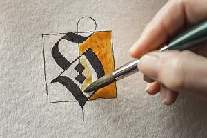 Handmade Calligraphy Drucke: Calligraphy studio, hand paints surface with brush