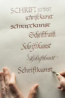 Calligrapher In Upper Bavaria Drucke: Calligraphy studio, hand writes text with ink