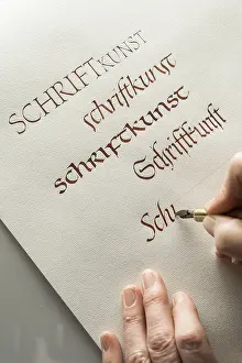 Calligraphy Studio Drucke: Calligraphy studio, hand writes text with ink