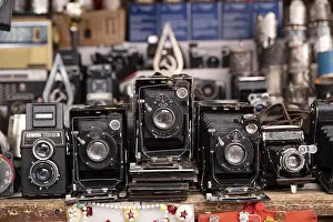 Drucke von Kamera, Kamera, Retro, historisch, Flohmarkt, Einäugig, Bellows , russisch , viele , mehrere , in Reihe , in einer Reihe Hintergrund Illustration USSR Flöhe Drucke: Kamera, Kamera, Retro, Historisch