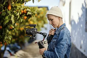 Movie Camera Operator Drucke: Camera operator with movie setup including a gimbal