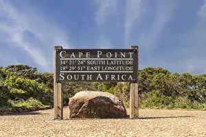 Cape Town Travel Photography Drucke: Cape Point sign with coordinates next to the lighthouse path with stunning clouds