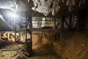 Heavy Duty Construction Equipment Drucke: A captivating view of an underground tunnel under construction
