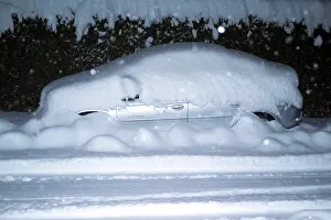 Car Covered In Snow Drucke: Car, silver, completely snowed
