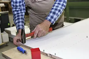 Traditional Craftsmanship Techniques Drucke: Carpenter at work in his carpentry workshop