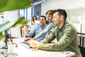 Modern Office Collaboration Drucke: Programmers collaborating on code in a bright