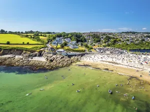 Aerial View Of Cornwall Drucke: Cliffs over Swanpool Beach and Stack Point from a drone