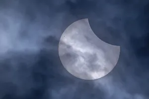 Solar Eclipse Germany Drucke: Partial solar eclipse with clouds in the sky