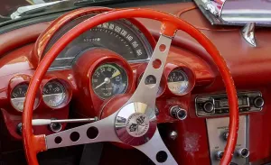 Uninhabited Countryside Europe Drucke: Red steering wheel with dashboard