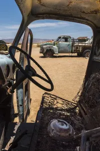 Barren Namib Desert Scenery Drucke: Wreck of an oldtimer in the desert