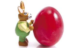 Easter Holiday Traditions Drucke: Small Easter bunny standing beside a painted Easter egg