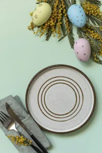 Colorful Easter Egg Display Drucke: Table setting for Easter dinner with easter eggs and mimosa on a pastel background