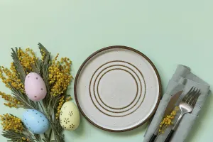 Easter Egg Decorations Drucke: Table setting for Easter dinner with easter eggs and mimosa on a pastel background