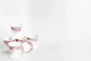 Bright Studio Background Drucke: Ceramic egg cup with reddish pattern on white background