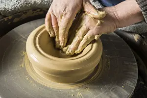Ceramic Workshop Detail Drucke: Ceramic workshop, hands shape on pottery wheel