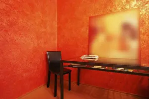 Red Wall Background Drucke: Chair and table on a background of a red wall