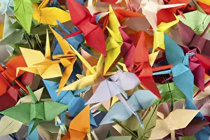 Colorful Bird Photography Drucke: A chaotic array of multicolored origami cranes overlapping each other
