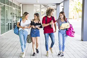 Female Student Portrait Drucke: Cheerful students communicating after lessons