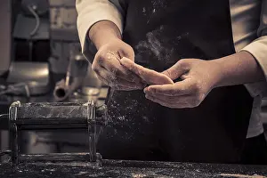 Wooden Table Kitchen Scene Drucke: The chef makes fresh pasta from scratch