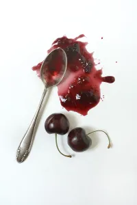 Studio Shot Of Cherries Drucke: Cherry jam with spoon, cherries
