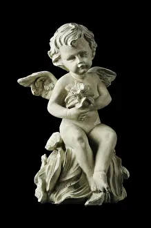 Archeological Site In Turkey Drucke: Cherub with dramatic side lighting on a black background