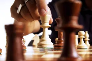 Chess Player Drucke: Chess player making a move