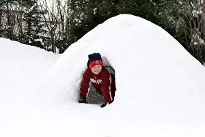 Happy Children Playing Outside Drucke: Child plays in igloo