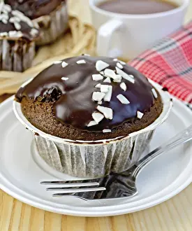 Decorative Pastry Display Drucke: Chocolate cupcake, fork on the plate