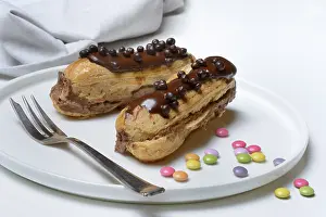 Chocolate Eclairs Drucke: Two chocolate eclairs on a plate