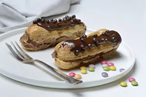 Chocolate Eclairs Drucke: Two chocolate eclairs on a plate
