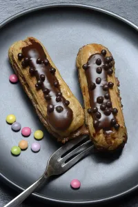 Chocolate Eclairs Drucke: Two chocolate eclairs on a plate