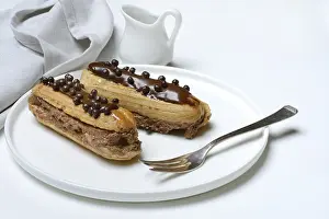Chocolate Eclairs Drucke: Two chocolate eclairs on a plate