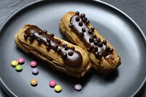 Chocolate Eclairs Drucke: Two chocolate eclairs on a plate
