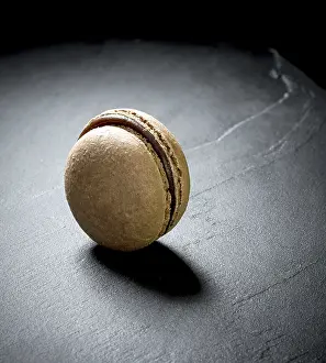 Close Up Food Photography Drucke: Chocolate macaron at the black background