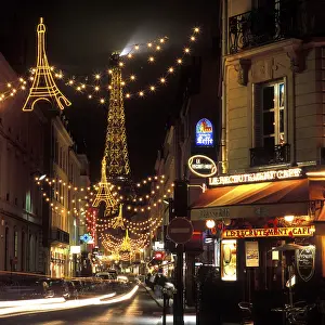 Christmasy Atmosphere In Europe Drucke: Christmas lights with the Eiffel Tower in the background