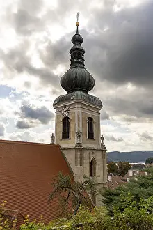 Cloudy Sky Atmosphere Drucke: Church tower with clock and dramatic clouds in the sky
