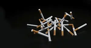 Black Background Studio Shot Drucke: Cigarettes Falling against Black Background