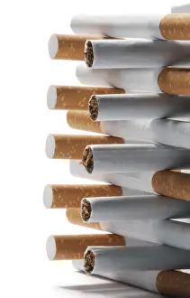 Bright Background Copy Space Drucke: Few cigarettes lying on a white background