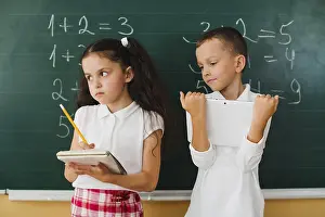 Student Learning Environment Drucke: Classmates blackboard math lesson