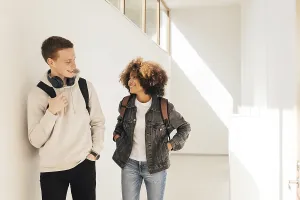 University Building Structure Drucke: Classmates walking in corridor