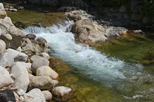 Caceres Tourist Attraction Drucke: Clear water flows over rocks in a small