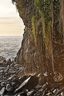 Rocky Coastline Images Drucke: Cliffs and a rocky coast with a small waterfall