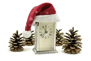 Deserted Clock Tower Drucke: Clock with Santa hat and pine cones over white