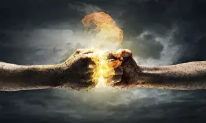 Aggressive Body Language Drucke: Close up of two fists hitting each other over dramatic sky background