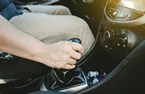 Empty Street Traffic Scene Drucke: Close up of hand accelerating on gear stick