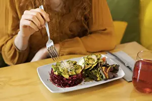 Diet Food Photography Drucke: Close up hand holding fork