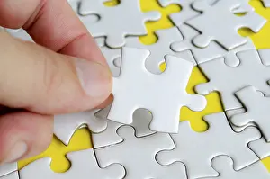 Close Up Jigsaw Puzzle Drucke: Close up of hand place missing jigsaw puzzle representing problem solving skill