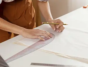 Architectural Design Drucke: Close up hands with ruler pencil